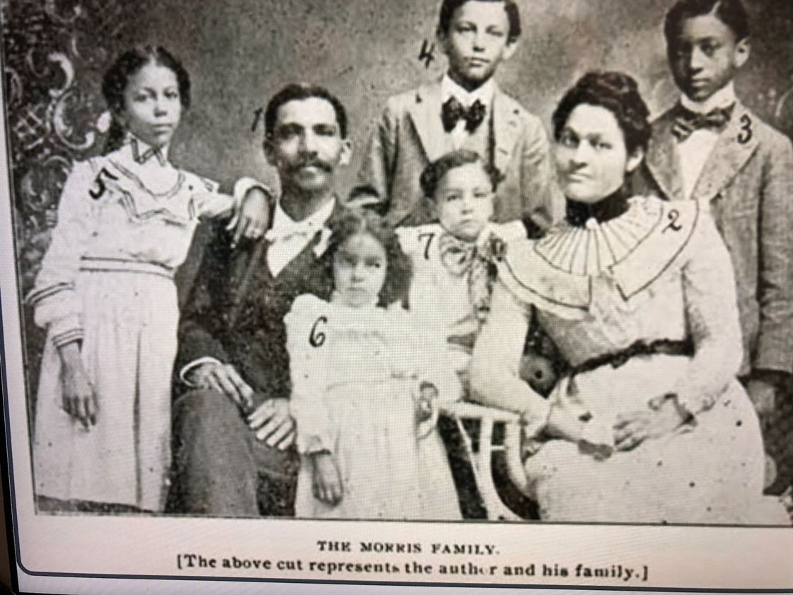 Before: a black and white family photo printed in an old book